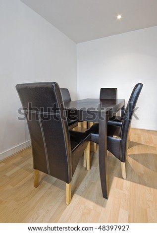 luxury hard wood dining table with leather chairs