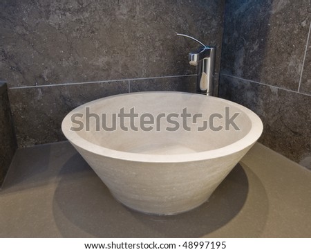 natural stone designer hand wash basin with chrome tap over