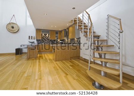 modern open plan kitchen in a designer apartment with mezzanine