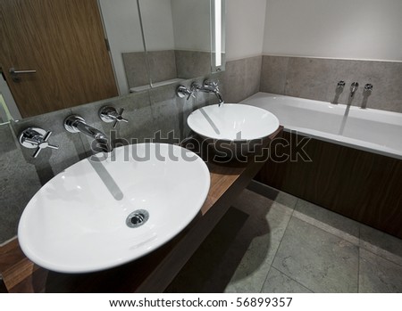 modern family size bathroom with double hand wash basin