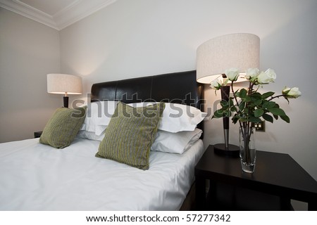bedroom detail with double bed and bedside tables