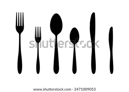 Black and White Cutlery Set. Vector isolated illustration of a fork, a spoon and a knife silhouettes