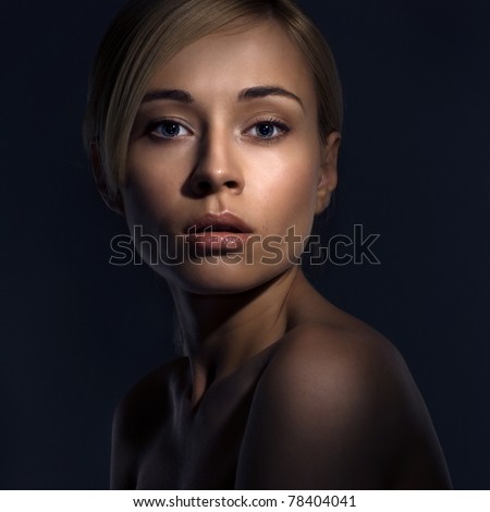 Portrait of a beautiful female model on dark background