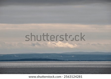 Similar – Foto Bild Blick über ein graues Zweckgebäude hinweg auf ein Bürogebäude mit Fenstern in Teilansicht vor blauem Himmel mit einer einzelnen Wolke