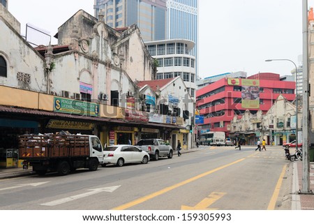 KUALA LUMPUR - JUN 15: Grecian-Spanish style buildings on Little India street on Jun 15, 2013 in Kuala Lumpur, Malaysia. Chinatown is home to much of the city?s budget accommodation.