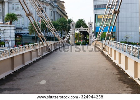 SINGAPORE - 07 AUG 2015: Historic Cavenagh Bridge, spanning the Singapore River near Raffles Place.