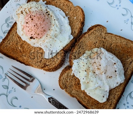 Similar – Image, Stock Photo Two poached eggs on brown bread