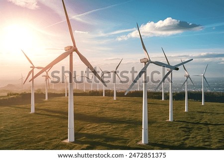 Similar – Image, Stock Photo Rotating windmill generating renewable energy wind power at land