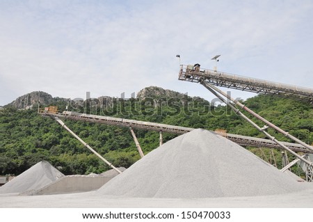 Conveyor belts with piles of gravel