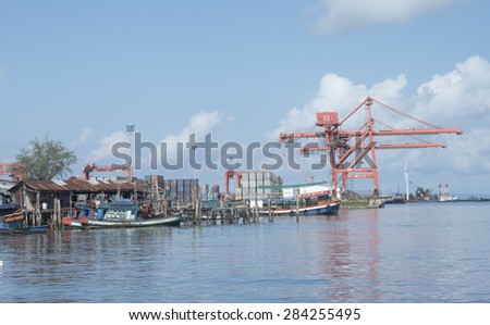 SIHANOUKVILLE SEA PORT - JUNE 4: Goods and products of Cambodia are exported by ships at Sihanoukville sea port on June 4, 2015. Sihanoukville sea port is the biggest port of Cambodia.