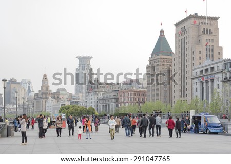 SHANGHAI - APRIL 16: Tourists come to visit the bund on April 16, 2015 in Shanghai. The bund is the western bank of the Hangpu river facing Pudong district.