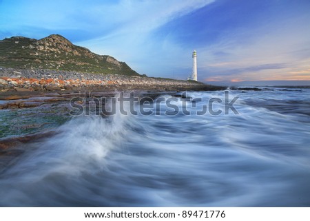 Lighthouse and wave