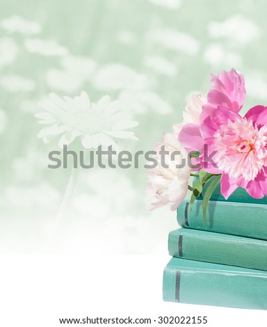 Education card. Pink peonies and green books on the light flower background