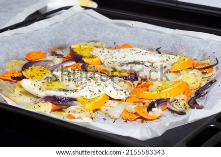 White fish papillote with vegetables, extra virgin olive oil, orange and dill, on baking paper, healthy food concept Stock foto © 