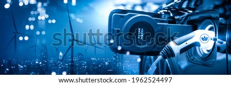 Vehicle EV electric car charge battery with wind turbine and blue sky blur bokeh on panoramic cityscape background. Idea nature electric energy to generate electricity. Green drive energy eco concept