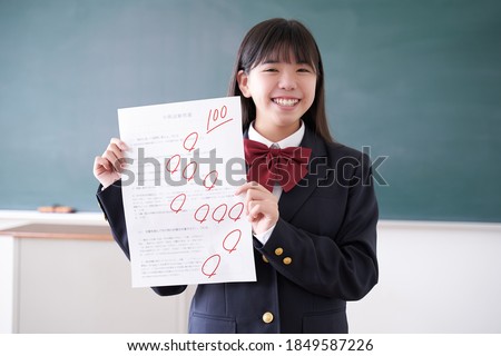 A Japanese junior high school girl who scored 100 on a test