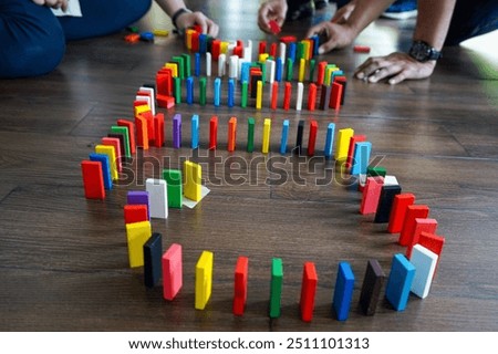 Similar – Image, Stock Photo The wooden domino blocks falling down