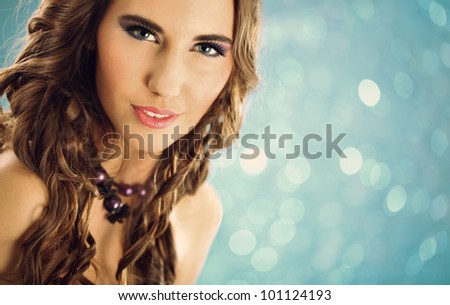 portrait of young beauty woman over blue background