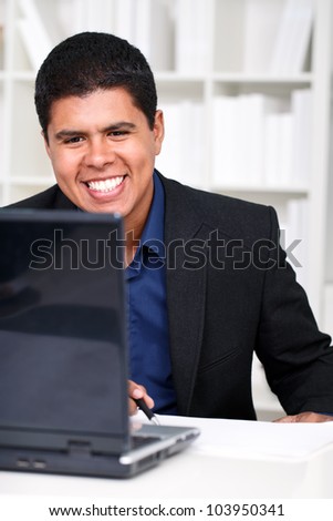 young happy business man working on laptop