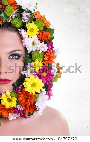 Close-up make-up womanÃ¢Â?Â?s face with border of flowers, isolated on white background