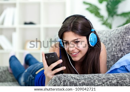 attractive young teenager girl listening to music