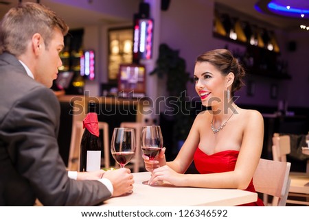 affectionate couple enjoying in a romantic restaurant