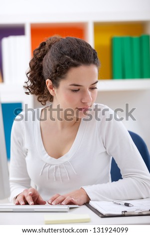 young woman learning  with the help of computers