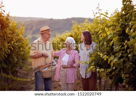 Similar – Image, Stock Photo Winegrower and daughter with bucket of grapes in countryside