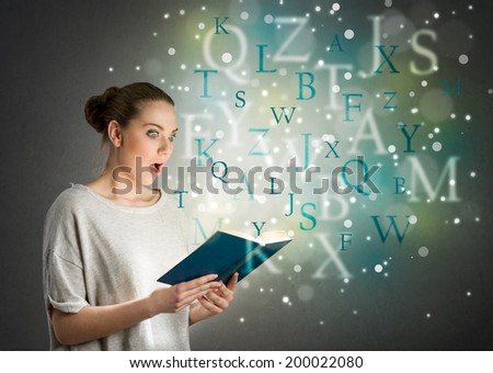 girl with astonishment looks in the book from which fly letters