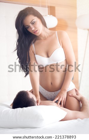 Passion couple having foreplay young woman seducing her boyfriend
