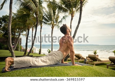 Similar – Image, Stock Photo Shirtless man doing yoga on terrace