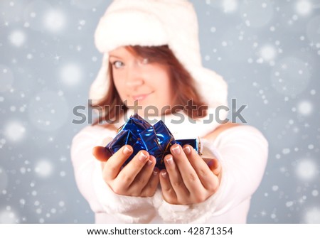 white snow queen giving a present - present in focus