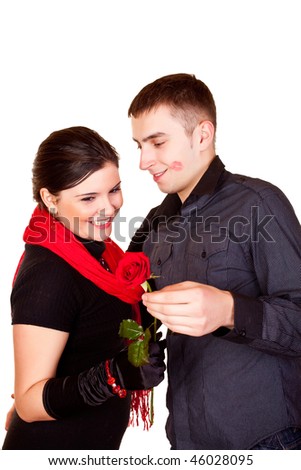young man giving a red rose to her girlfriend