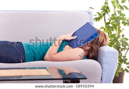 young girl fell a sleep while reading a book