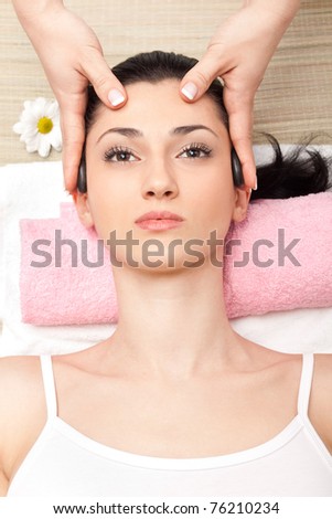attractive female getting recreation massage of head, top view