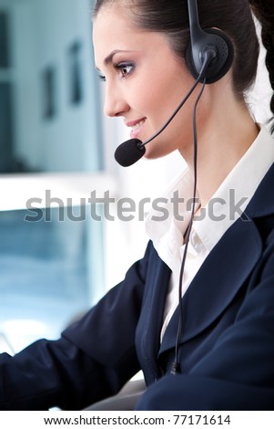 customer service operator woman with headset smiling, side view