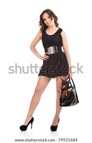 woman in sexy dress with her dog in bag , isolated on white background