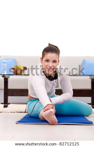 home fitness, Young beautiful woman exercising at home