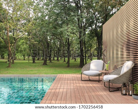 Swimming pool terrace with garden view 3d render,  There are a wooden floor ,green tile in the swimming pool and ,wooden lath wall,Decorated with rattan furniture,Surrounded by nature.