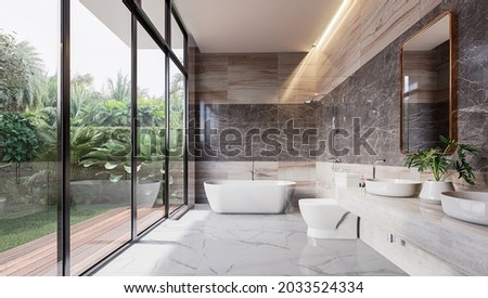 Modern luxury bathroom with tropical style garden view 3d render,There are marble floor and wall and copper frame mirror,Rooms have large windows, overlook nature view.