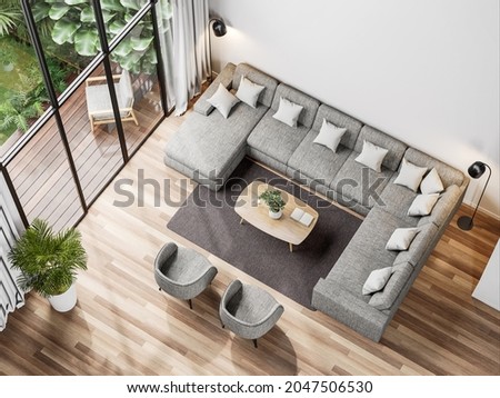 Top view of modern living room with tropical style garden view 3d render,The Rooms have wooden floors ,decorate with gray fabric sofa, Overlooks wooden terrace and green garden.