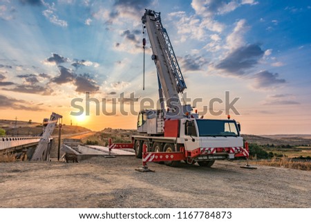 Similar – Image, Stock Photo Boom of a crane in front of colorful evening sky.