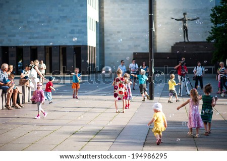 KAUNAS, LITHUANIA - MAY 26: BURBULIATORIUS (Bubble your city). A regular public event in Lithuania and other countries, every second Monday. People blowing bubbles on May 26, 2014, Kaunas, Lithuania