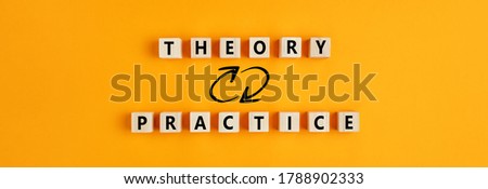 Concept of theory and practice relationship or connection. Wooden blocks with the words theory and practice on yellow background. 
