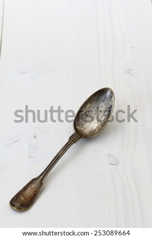 spoon on white wooden table.