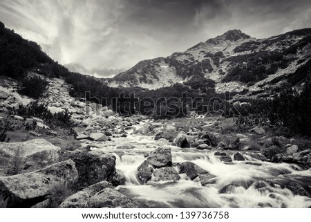 black and white landscape with cold high mountain River in Pirin mountain