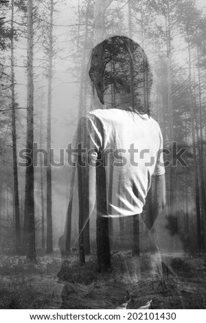 Abstract black and white double exposure portrait of woman in forest