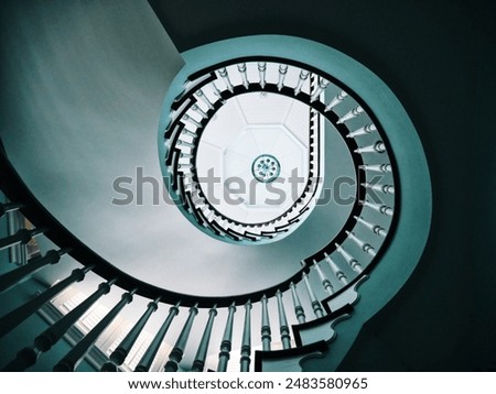 Similar – Image, Stock Photo Spiral staircase in the evening sun and mirrored in a glass façade