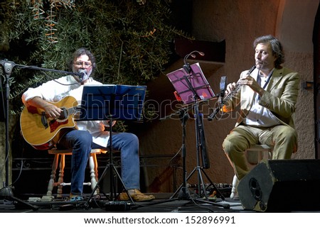 ERBUSCO,ITALY - AUGUST 30:  exhibition live of  guitar player Giorgio Cordini and the player of wind instruments Mario Arcari  at event 