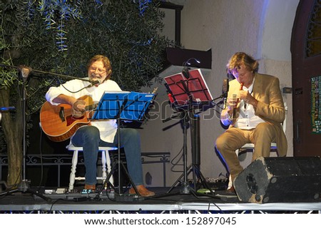 ERBUSCO,ITALY - AUGUST 30:  exhibition live of  guitar player Giorgio Cordini and the player of wind instruments Mario Arcari  at event 